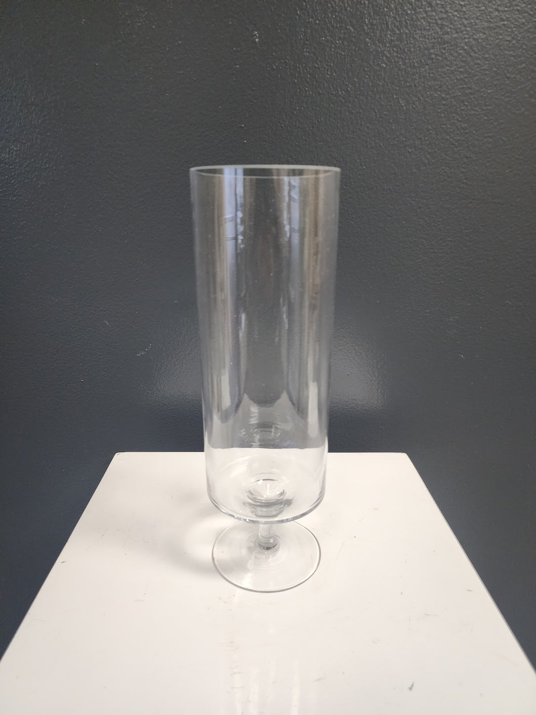 Small clear glass footed hurricane